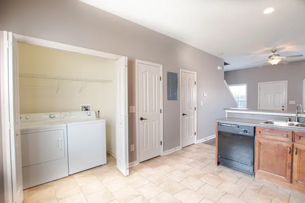 a view of a kitchen with electric appliances