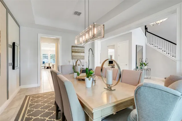 a kitchen with white cabinets and appliances