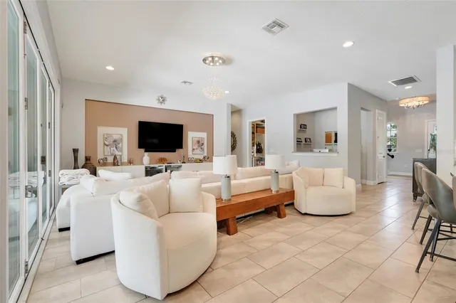 a view of a workspace with furniture and flat screen tv