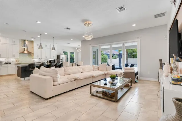 a room with pool table and window
