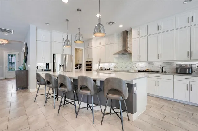 a bedroom with a bed and a flat screen tv in it