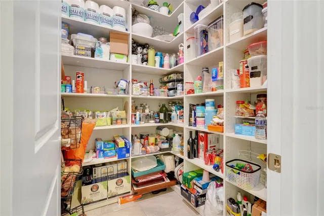 a bathroom with a sink a toilet and shower a mirror