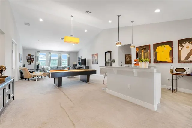 a bathroom with a double vanity sink toilet and shower