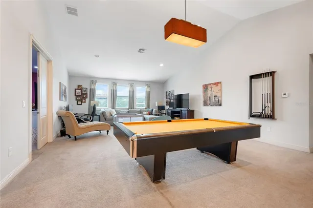 a bedroom with a bed and a lamp