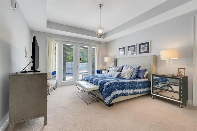 a bedroom with furniture and a wooden floor