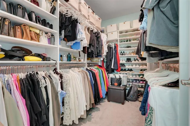 a view of a livingroom with furniture and a potted plant