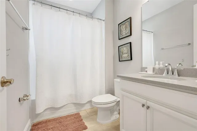 an aerial view of a house with a swimming pool outdoor seating and yard