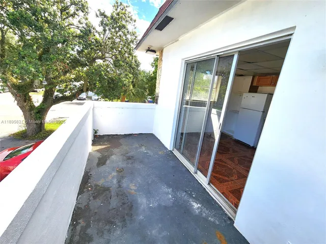 a view of a bathroom from a hallway