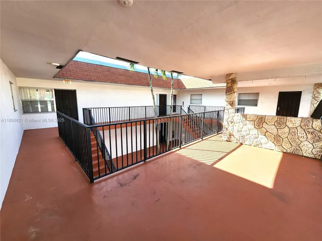 a car parked in front of a brick building
