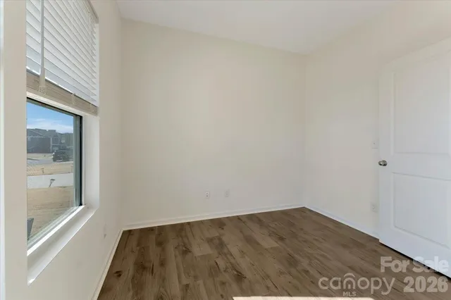 a view of a workspace with furniture and a potted plant