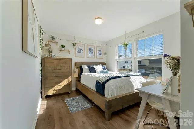 a large kitchen with a table and chairs
