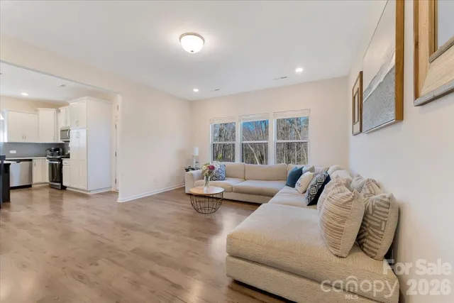 a view of entryway with stairs and wooden floor