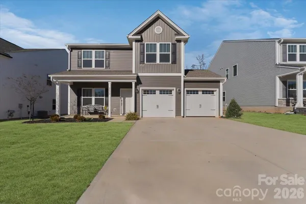 a house view with a garden space