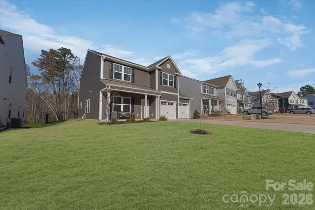 a view of a house with a backyard porch and sitting area