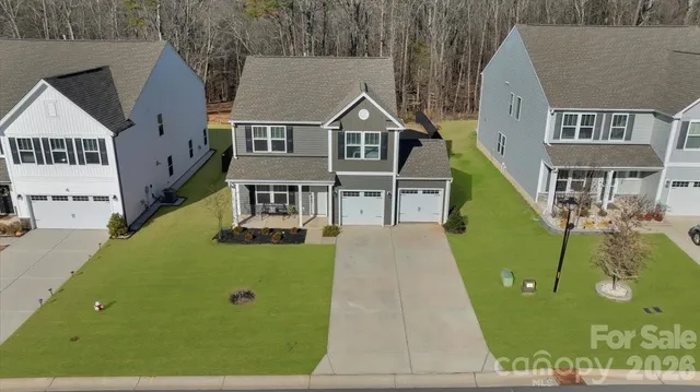 an aerial view of a house with swimming pool