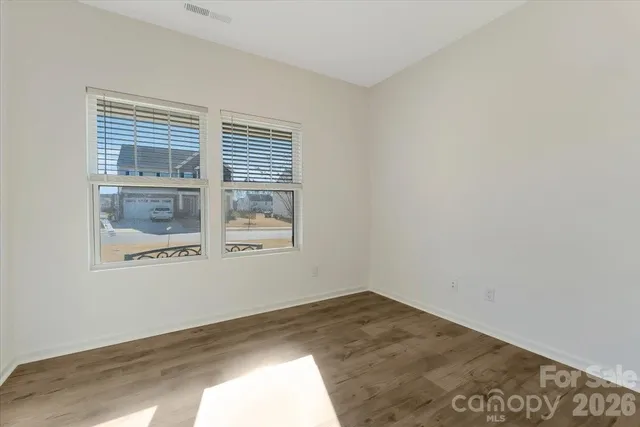 a workspace room with furniture and a window