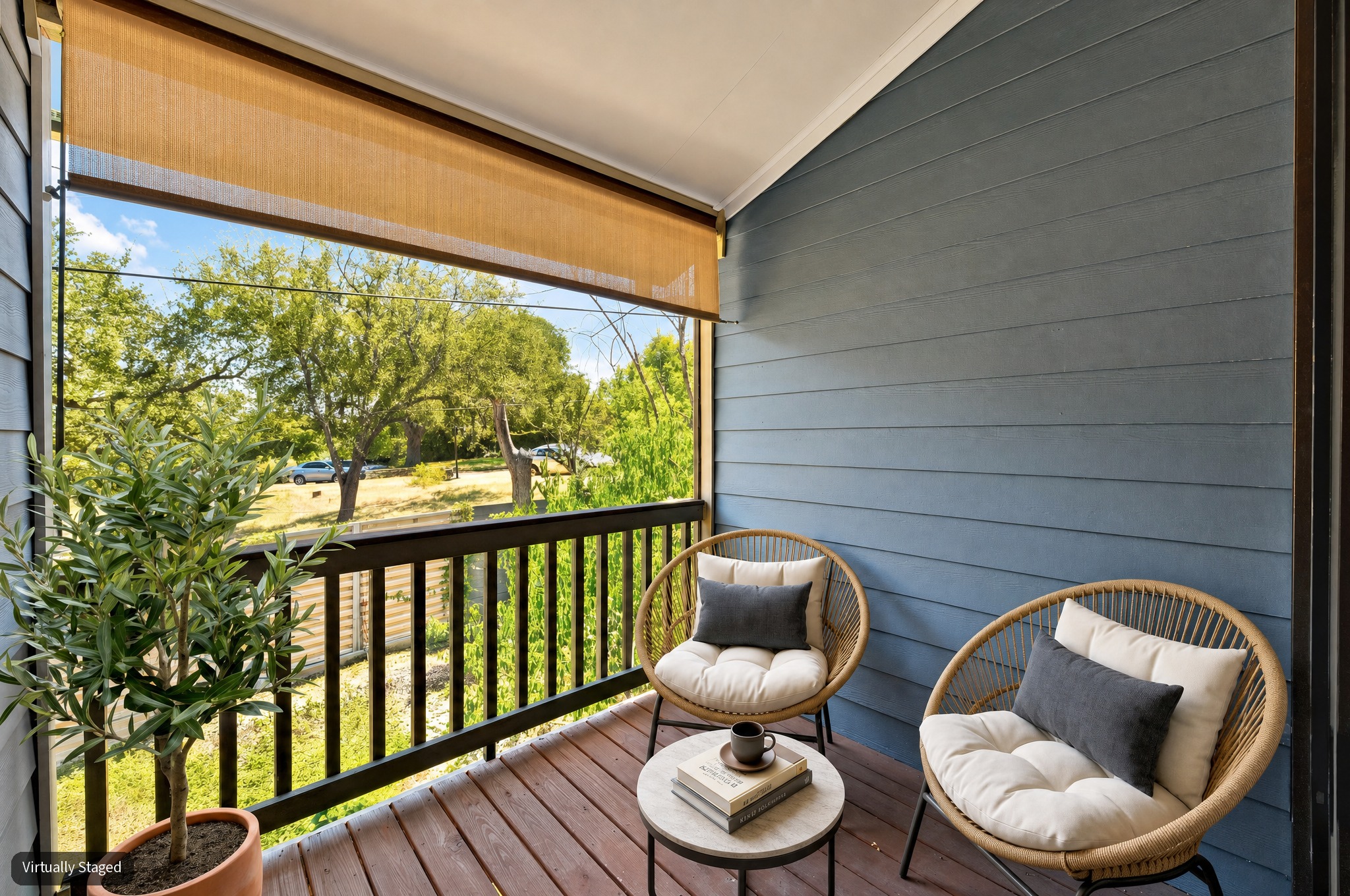 2215 Post Road, Unit 1039 Austin, TX 78704 - Photo 24 of 40 The second floor balcony boasts peaceful views of the treelined cul-de-sac behind the units and comes with a pull down shade. (virtually staged pic)