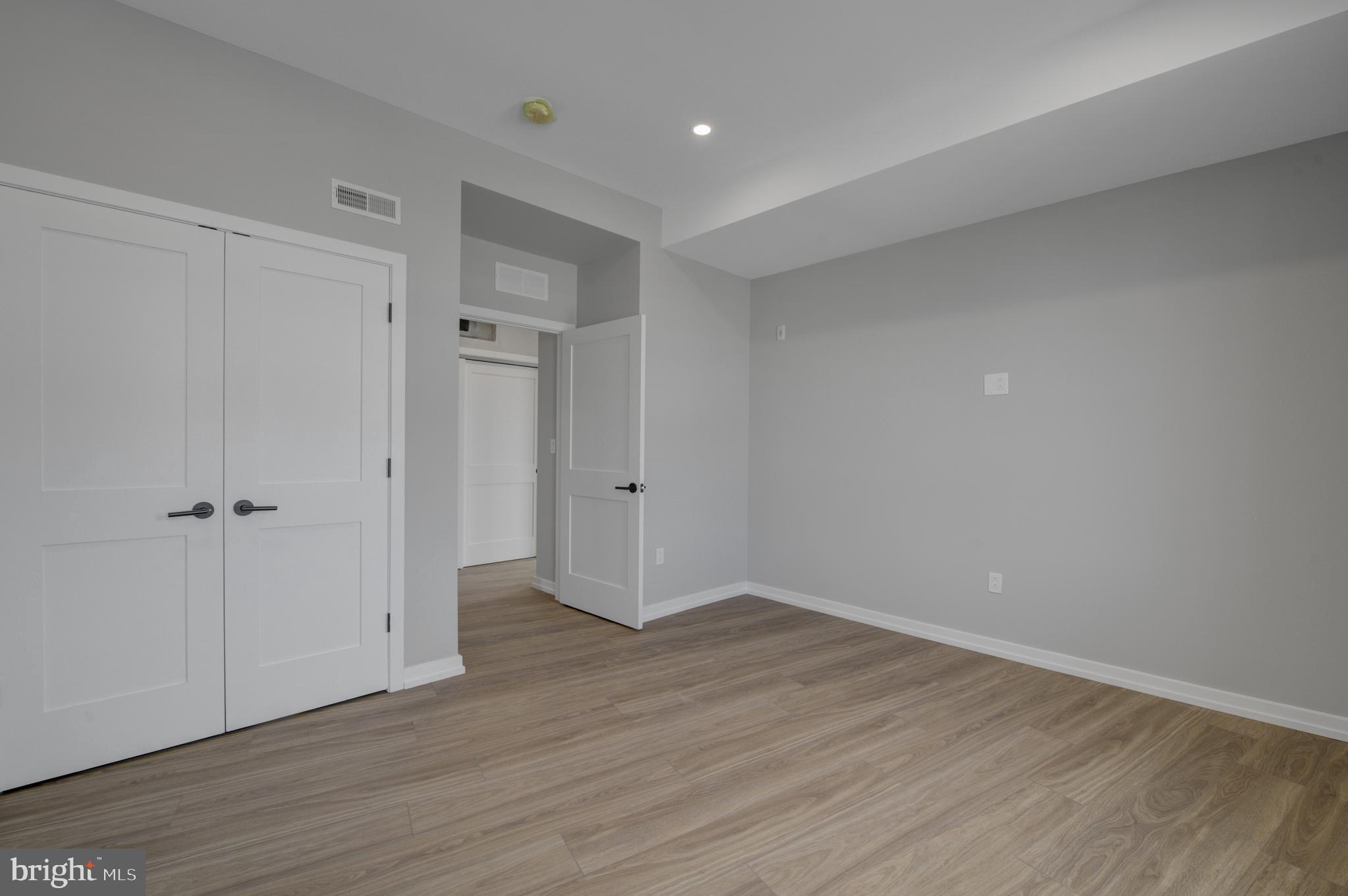 2445 Innovator Way, Unit 3A Philadelphia, PA 19146 - Photo 2 of 17 a view of an empty room with wooden floor