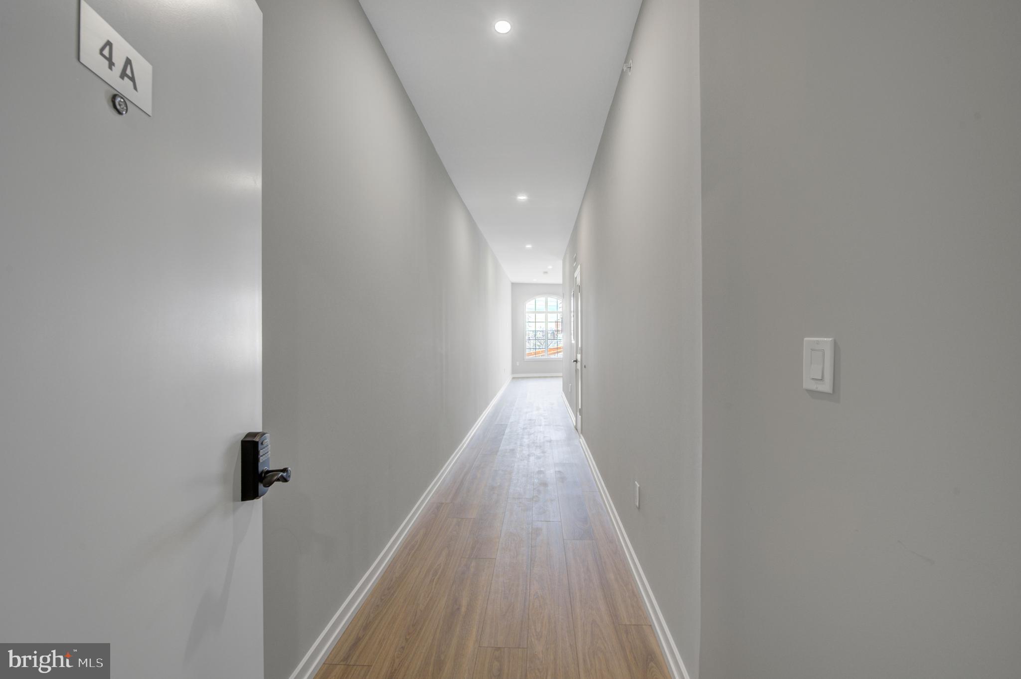 2445 Innovator Way, Unit 3A Philadelphia, PA 19146 - Photo 7 of 17 a view of a hallway with wooden floor