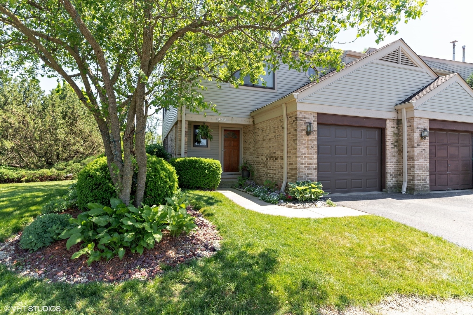 1430 Waukegan Road Deerfield, IL 60015 - Photo 1 of 20 a front view of a house with garden