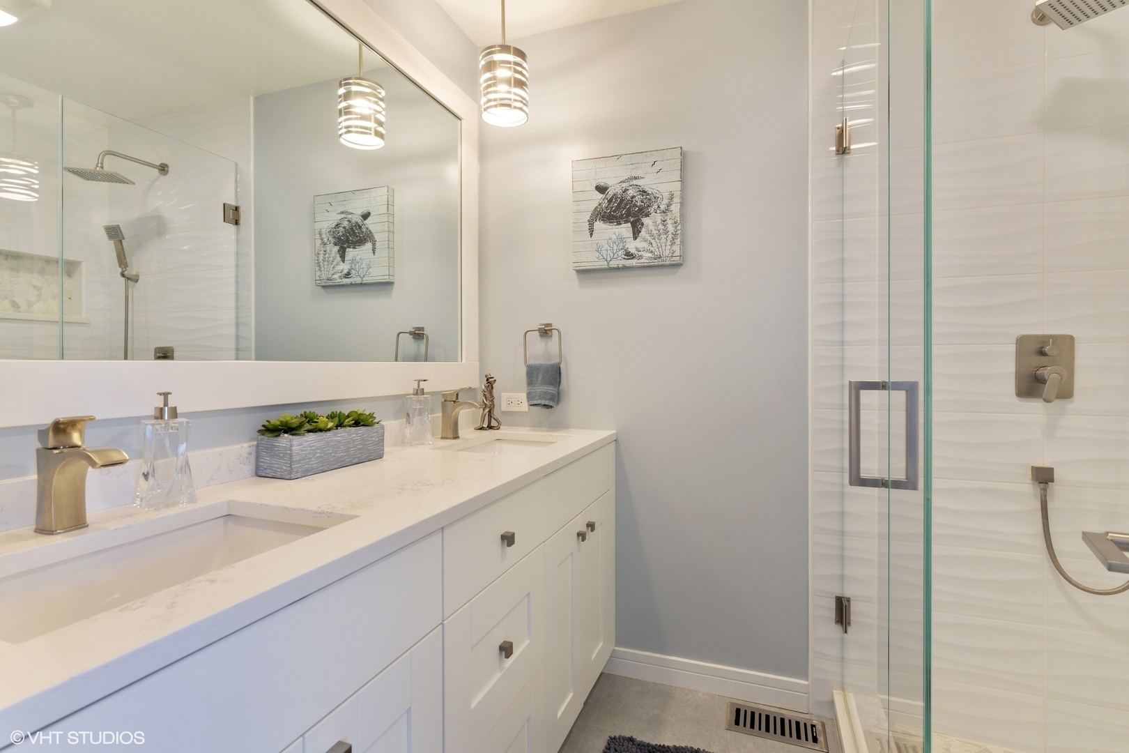 1430 Waukegan Road Deerfield, IL 60015 - Photo 9 of 20 a bathroom with a shower sink and mirror
