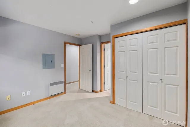 an empty room with closet area