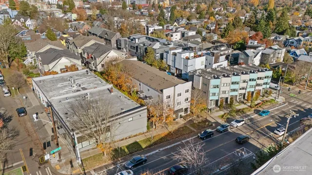 an aerial view of a building with parking