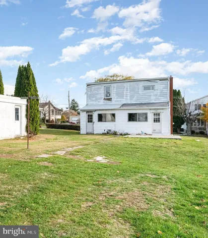 a view of a house with a big yard