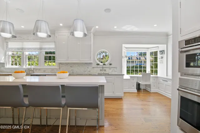 a kitchen with a sink cabinets and window