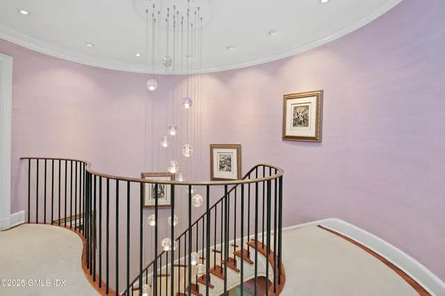 a spacious bedroom with a bed and a cabinets