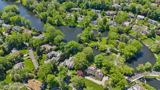 a front view of a house with a yard table and chairs