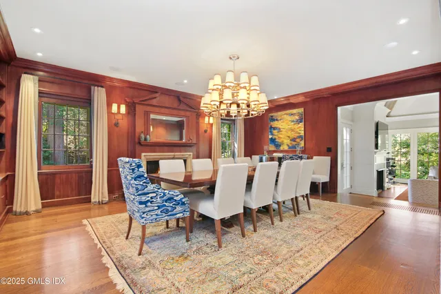 a view of a living room with furniture and a large window