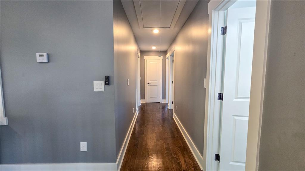 49 Sweetgum Street Talmo, GA 30575 - Photo 14 of 36 a view of hallway with wooden floor