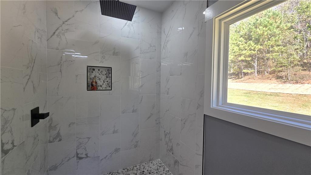 49 Sweetgum Street Talmo, GA 30575 - Photo 20 of 36 a bathroom with a shower