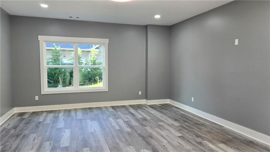 49 Sweetgum Street Talmo, GA 30575 - Photo 24 of 36 a view of room with window and hardwood floor
