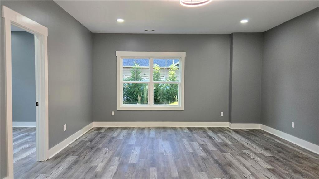 49 Sweetgum Street Talmo, GA 30575 - Photo 27 of 36 wooden floor in an empty room with a window