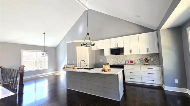 a room with cabinets and flat screen tv