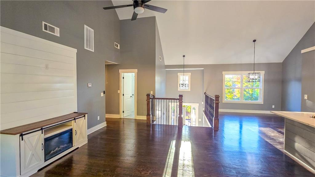 49 Sweetgum Street Talmo, GA 30575 - Photo 6 of 36 a view of empty room with wooden floor and fan