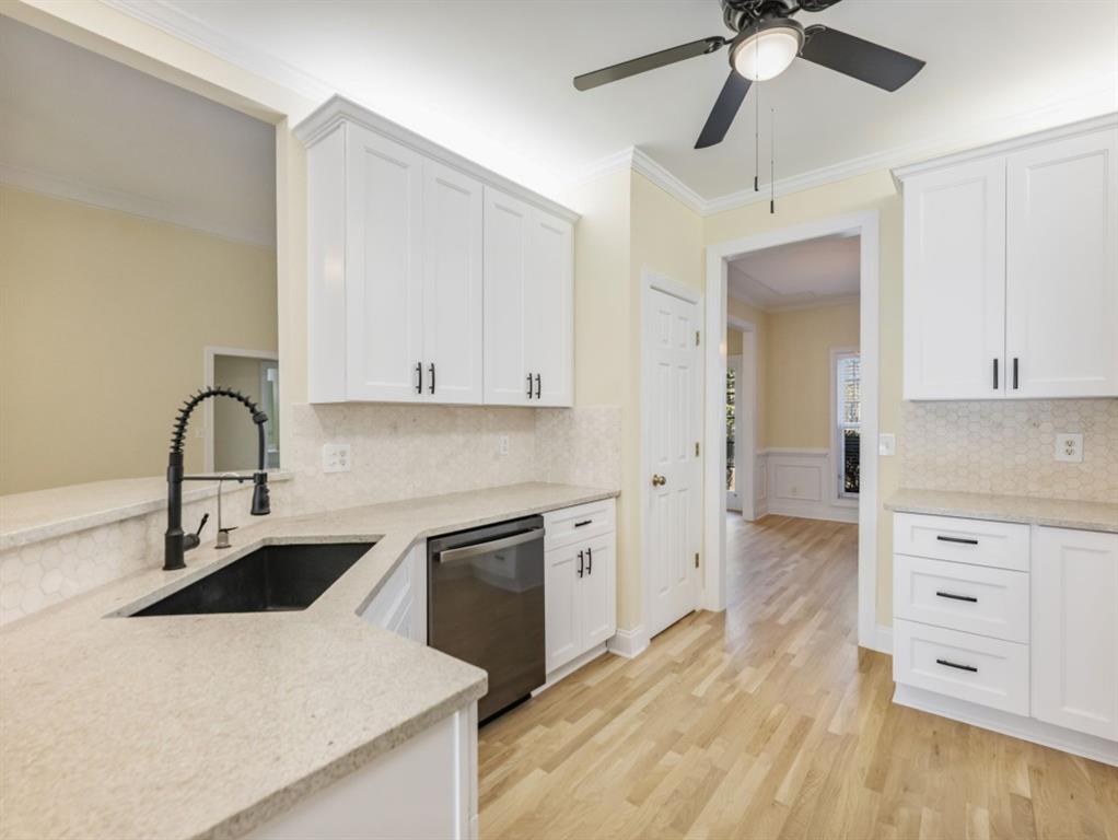 799 Gold Crest Road Braselton, GA 30517 - Photo 13 of 71 a kitchen with stainless steel appliances a sink a stove and a refrigerator