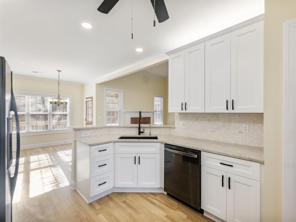 799 Gold Crest Road Braselton, GA 30517 - Photo 16 of 71 a kitchen with white cabinets and sink
