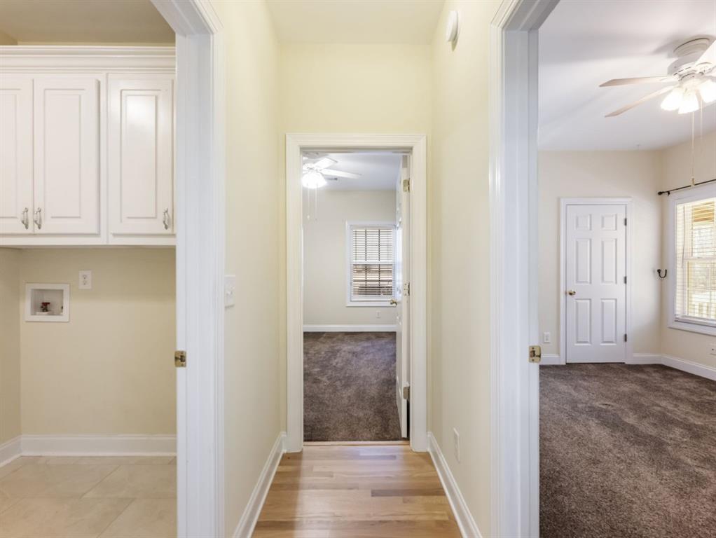 799 Gold Crest Road Braselton, GA 30517 - Photo 17 of 71 a view of a hallway with wooden floor and closet