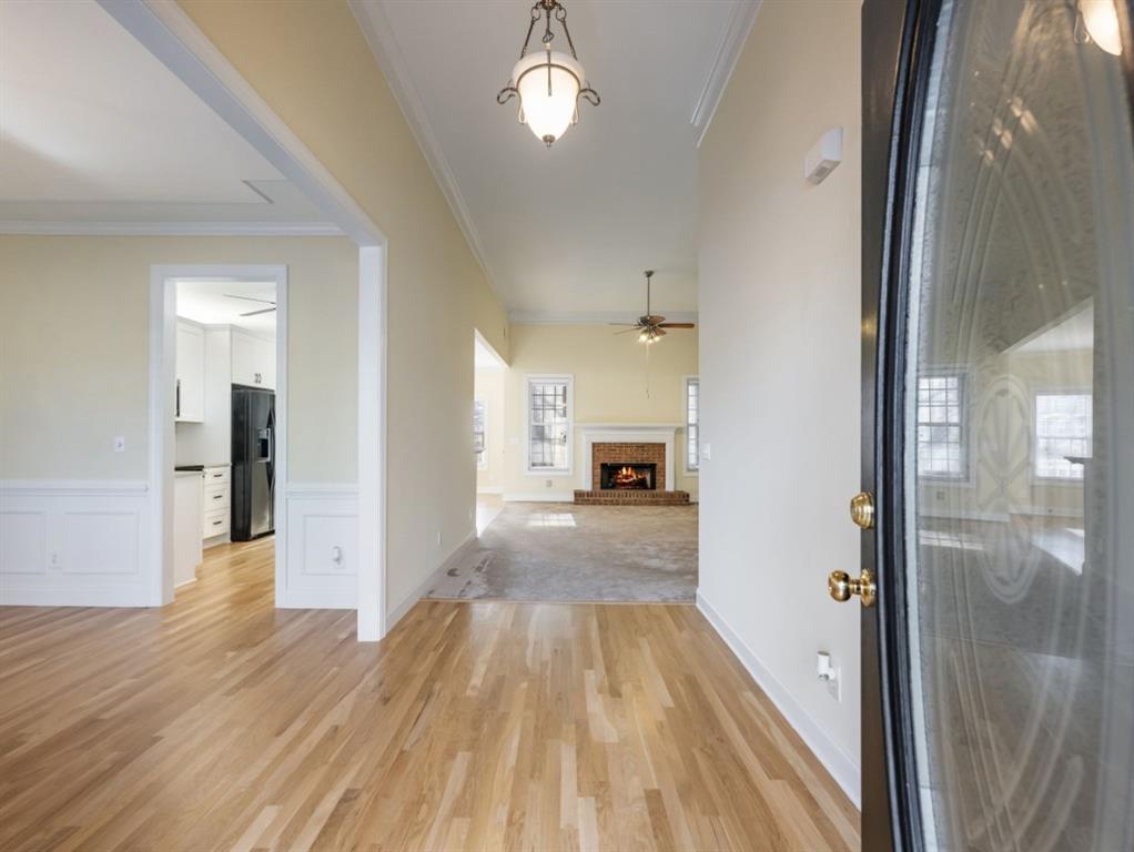 799 Gold Crest Road Braselton, GA 30517 - Photo 2 of 71 a view of a hallway view with wooden floor and windows