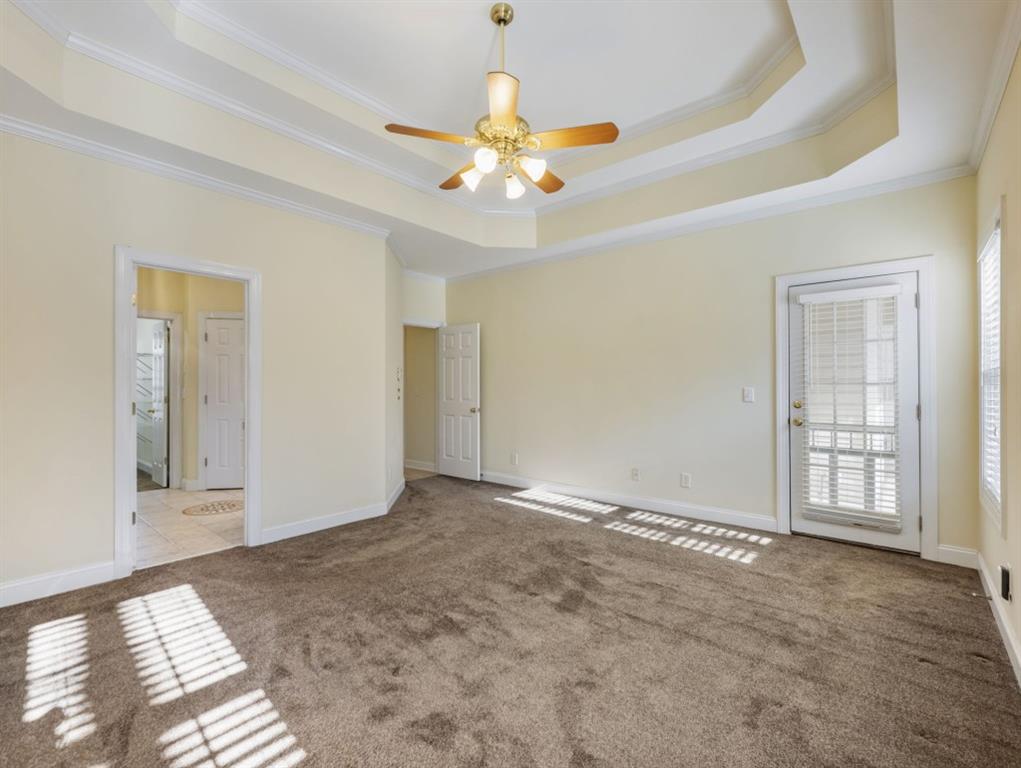 799 Gold Crest Road Braselton, GA 30517 - Photo 30 of 71 a view of an empty room with window and chandelier fan