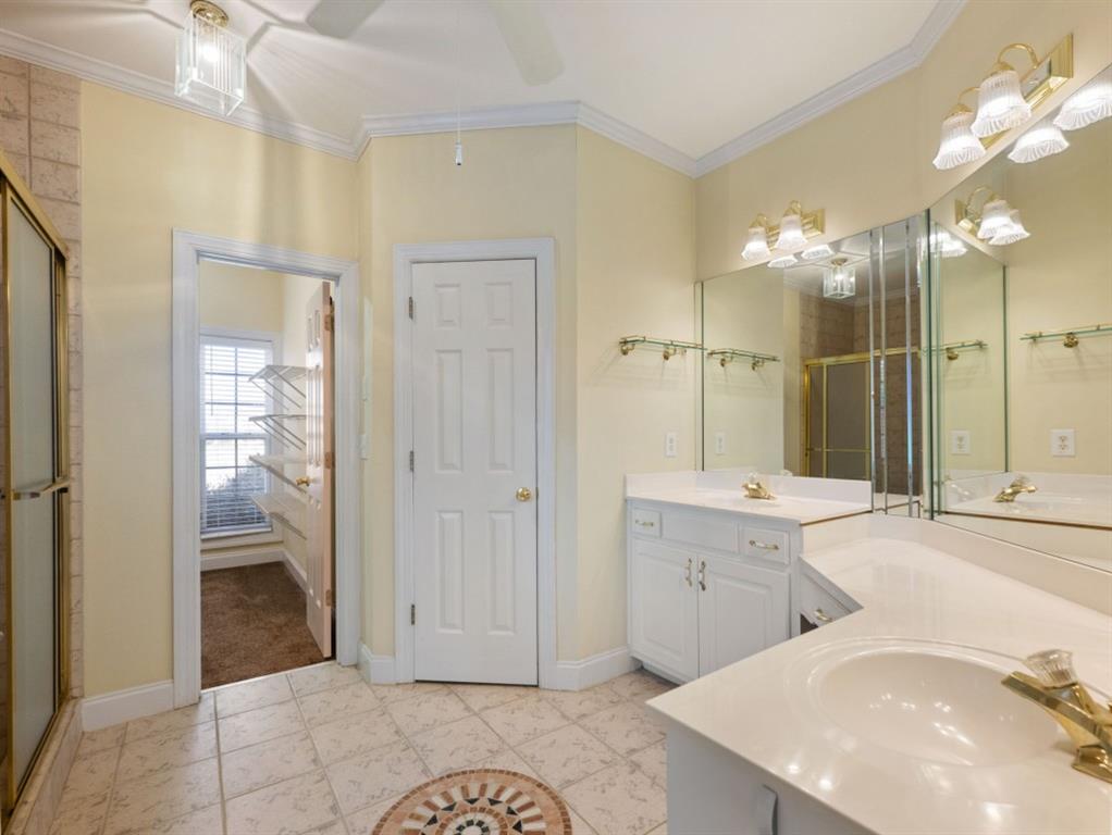 799 Gold Crest Road Braselton, GA 30517 - Photo 32 of 71 a spacious bathroom with a sink a mirror and a shower