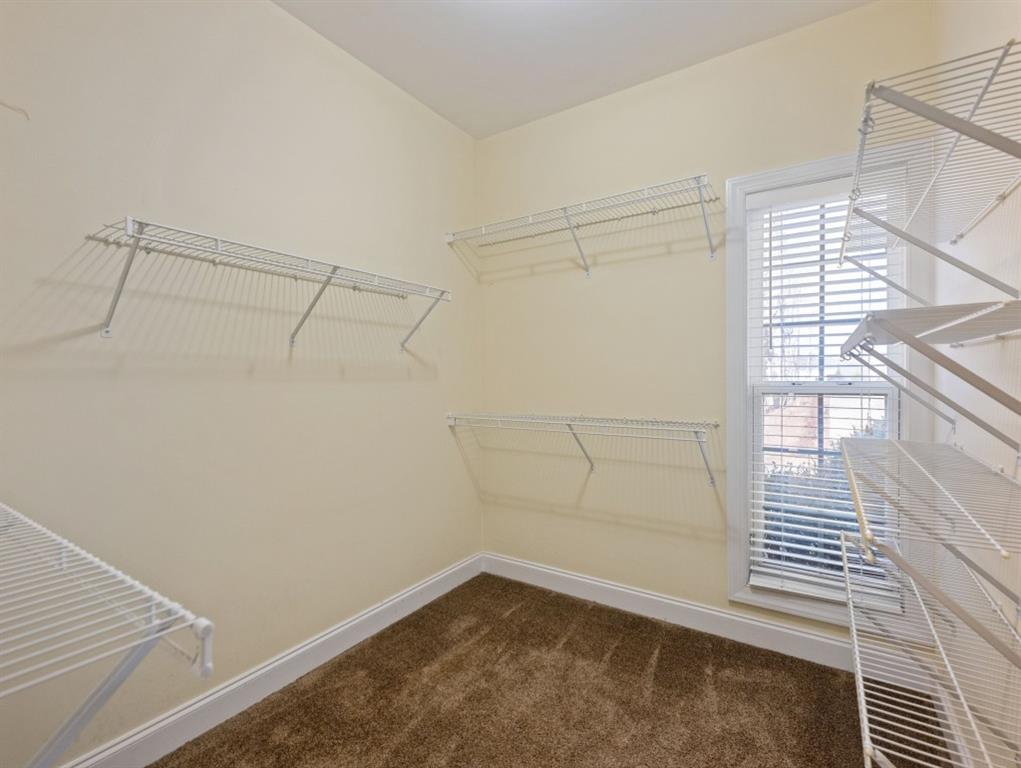 799 Gold Crest Road Braselton, GA 30517 - Photo 35 of 71 a view of a room with racks on the wall
