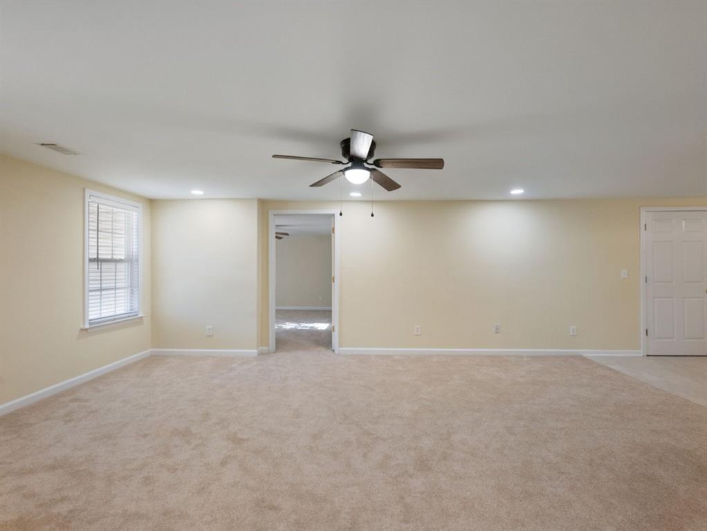 799 Gold Crest Road Braselton, GA 30517 - Photo 42 of 71 a view of an empty room with a ceiling fan
