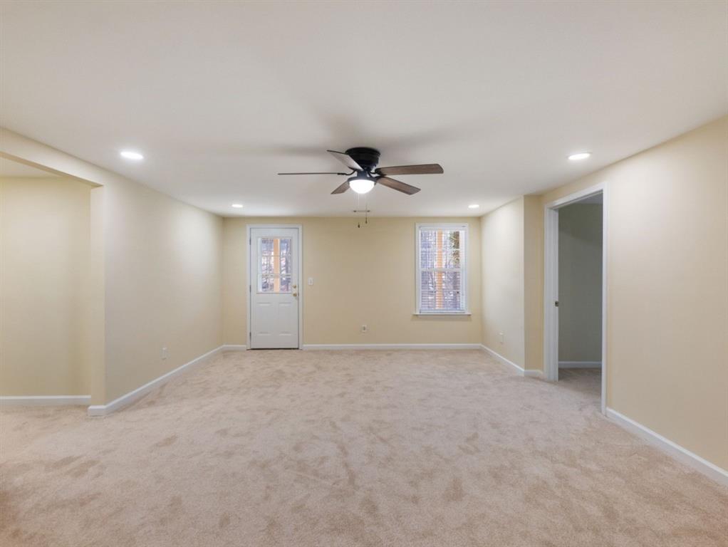 799 Gold Crest Road Braselton, GA 30517 - Photo 43 of 71 a view of an empty room with a ceiling fan
