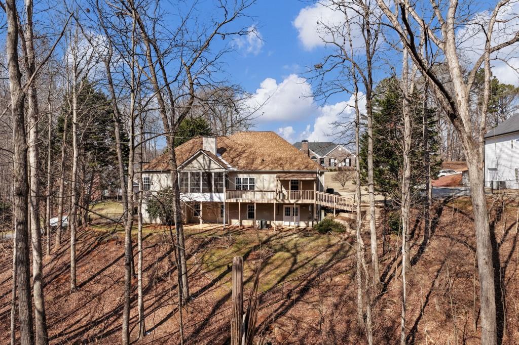 799 Gold Crest Road Braselton, GA 30517 - Photo 52 of 71 a view of a house with a yard