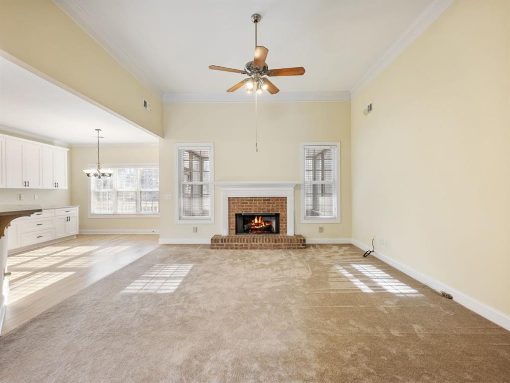 799 Gold Crest Road Braselton, GA 30517 - Photo 6 of 71 a view of an empty room with a fireplace