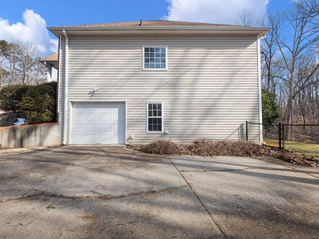 799 Gold Crest Road Braselton, GA 30517 - Photo 70 of 71 a front view of a house with a yard and garage